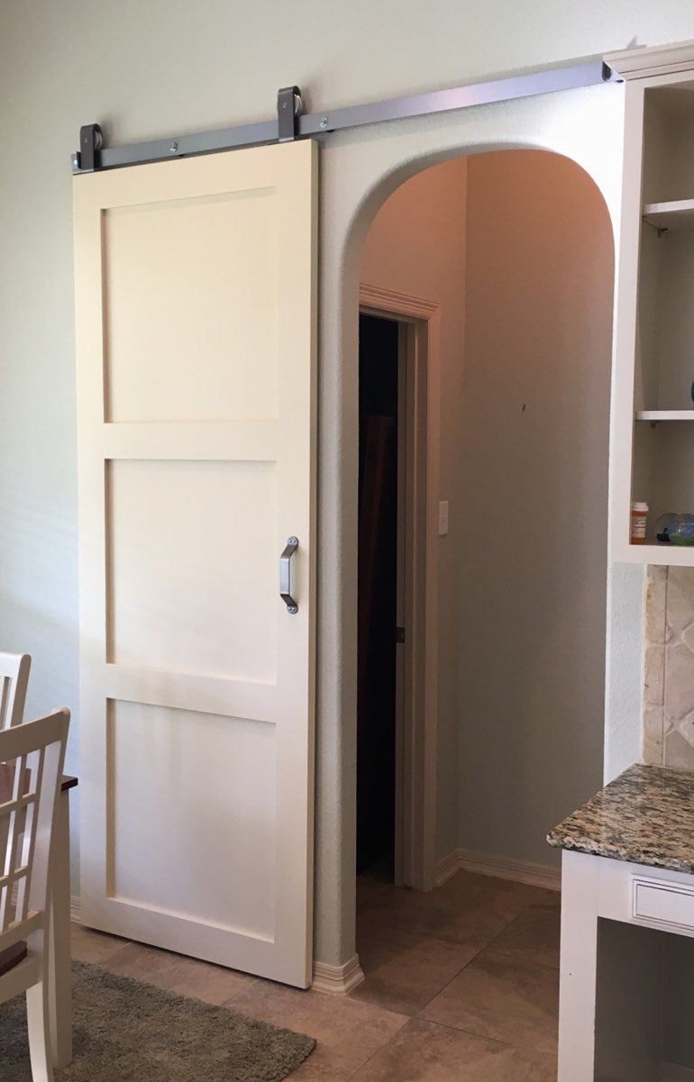 Shaker style barn door in Atlanta kitchen.